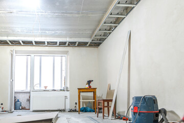 Renovation in the house. Wooden table for repair, installation of a frame for drywall and putty