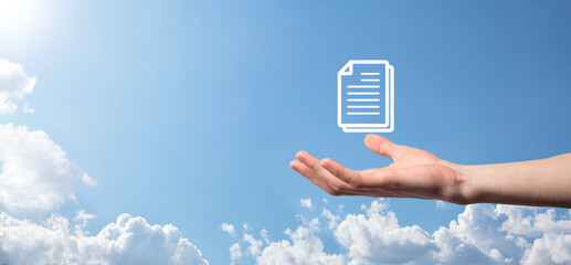 Male hand holding a document icon on blue background. Document Management Data System Business...