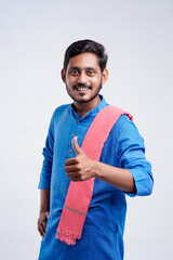 Young indian farmer giving expression on white background.