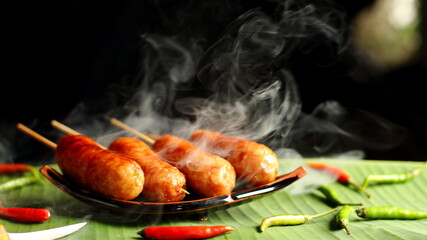 Hot sausage on a dark background with bokeh