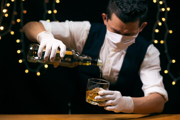 Barman pouring whiskey whiskey glass beautiful night
