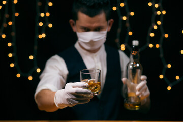 Barman pouring whiskey whiskey glass beautiful night
