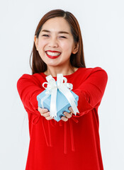 Fototapeta premium Cheerful ethnic woman with present in studio