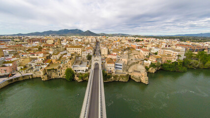 Fototapeta premium aerial views of the ebro river with boats and villages