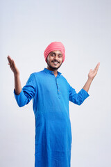 Young indian farmer giving expression on white background