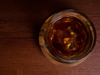 A cup of iced coffee on a wooden table