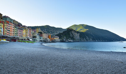 characteristic pebble beach in Camogli, with sea view and glimpse of the city