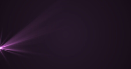 Glowing purple rays of light moving against black background