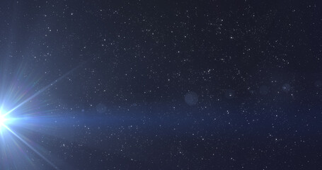 Obraz na płótnie Canvas Glowing blue rays of light moving in the night sky