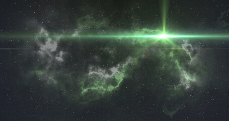 Bright green spot of light moving over white and green nebula in the night sky