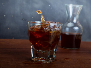 A cup of iced coffee on a wooden table