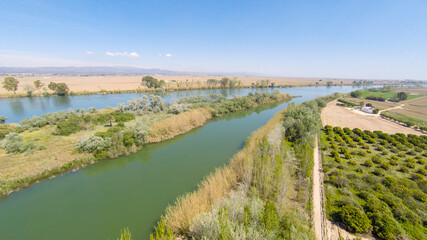 aerial views of the ebro river with boats and villages