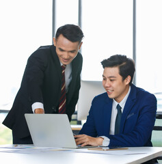 Businessmen working together in office