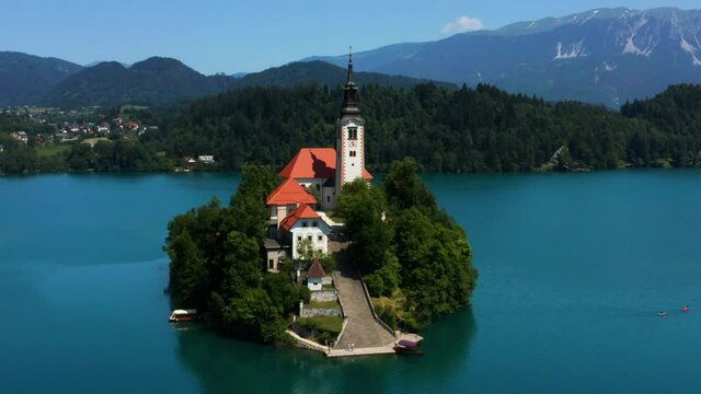 Aerial View Of Bled Island With Cafe, Provost House And Pilgrimage Church of the Assumption of Maria By The Lake in Bled, Slovenia.
