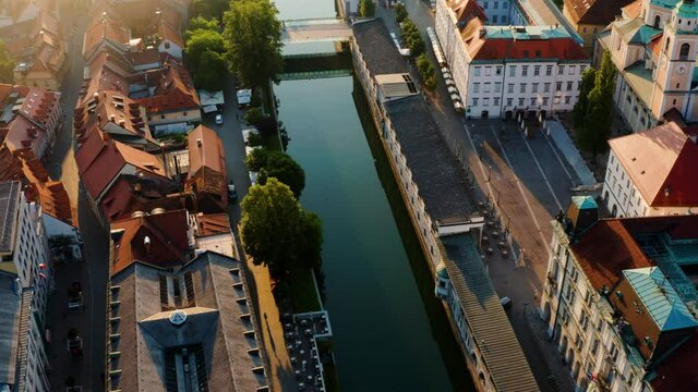 Butcher's Bridge And Dragon Bridge Across Ljubljanica River In Ljubljana, Slovenia On A Sunny Morning. Aerial View From Preseren Square.