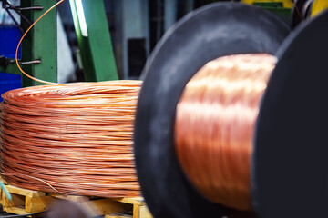 Closeup Copper wire cable production in coils, metal steel industrial plant
