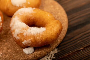 Fresh homemade doughnuts with powdered sugar. Close-up Selective focus.