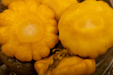 Pickled squash in a glass dish on a wooden table. Close-up Selective focus.