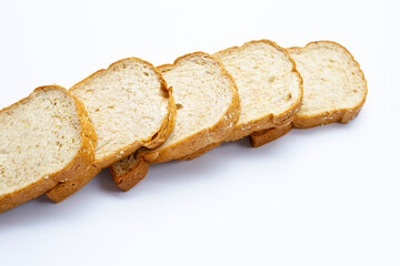 Sliced wholegrain bread on white background.