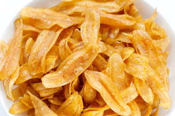 Banana slice chips in white  bowl