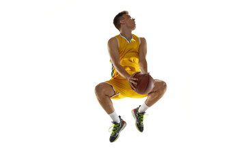 Fototapeta na wymiar Full length portrait of a basketball player with a ball isolated on white studio background. Advertising concept. Fit Caucasian athlete jumping with ball.