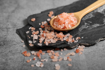 Himalayan pink salt in wooden spoon at kitchen