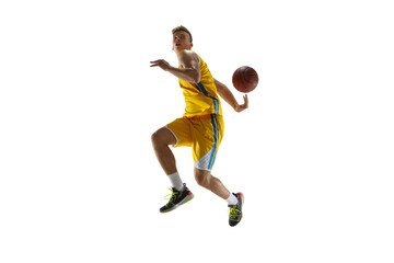 Side view. One young man, basketball player with a ball training isolated on white studio background. Advertising concept. Caucasian athlete in action.