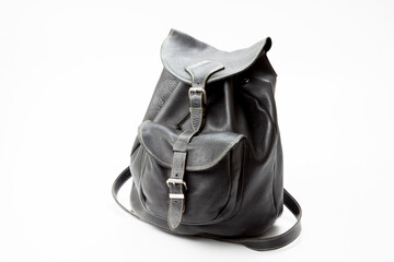 A black leather back pack on a white background