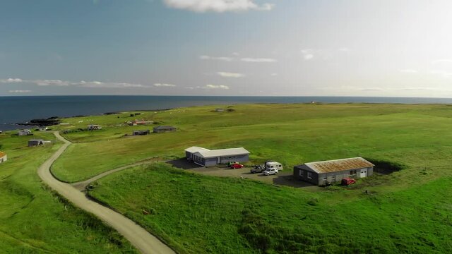 Arnarstapi coastline in sumemr season, Snaefellsnes peninsula, Iceland. Aerial view from drone. Slow motion