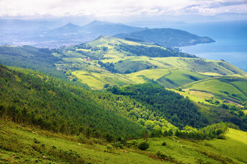Fototapeta na wymiar Panoramic view of the slope of the Jaizkibel mountain and the coast of the mouth of the Bidasoa river, Euskadi, Spain