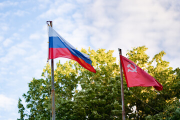 Russian flag and red banner of victory in great patriotic war in wind