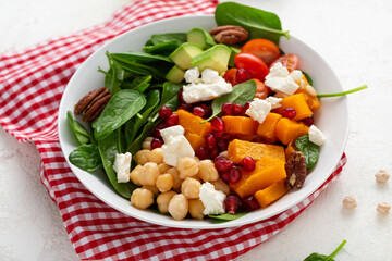 Autumn winter pumpkin salad with avocado healthy food