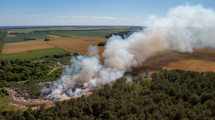 Burning rubbish dump. City dump on fire. Concept of ecological problem
