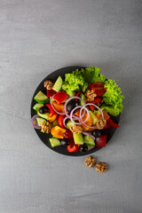 Overhead view of vegan greek salad on plate copy space healthy food