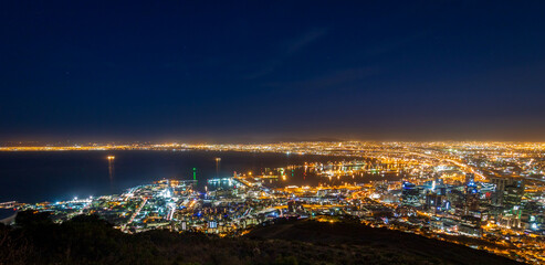 Naklejka premium Panoramic scenic view cityscape of Cape Town, South Africa by night.