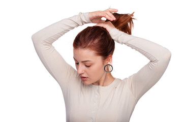 Portrait of a woman with a tunnel in her ears, and a pierced nose. White background, copy space....