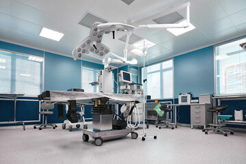 Large spacious operating board with a large amount of light, with modern equipment for various complex operations, operating table, lamps, ventilator.