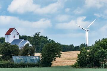 Ejerslev, Denmark,  The local church and a wind turbine.