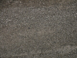 Blurred road texture. Small stones, sand, dust. Macro shooting.