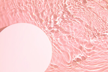 Empty white circle podium on transparent clear pink calm water texture with splashes and waves in...