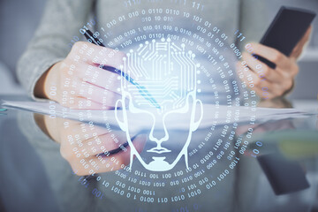 Double exposure of brain sketch hologram and woman holding and using a mobile device.