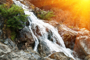 Fototapeta premium Landscape with waterfall in mountains 