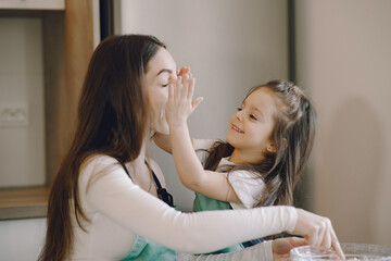 Family cook the dough for cookies