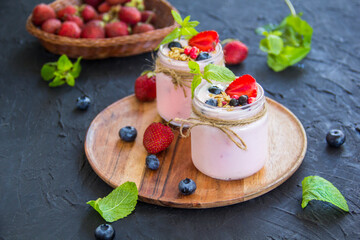 Healthy smoothie of fresh summer berries. Creative atmospheric decoration