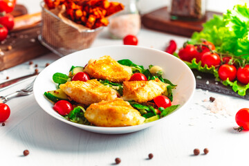 Camembert. Fried camembert cheese with batat fries. Cheese with salad with tomatoes. Fresh food