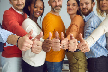 Group of different senior and young people giving thumbs up. Dream team of smiling friends, colleagues or business partners doing like gesture, hands closeup. Satisfaction, successful teamwork concept - obrazy, fototapety, plakaty