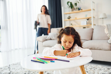 Conception of art. Mother and her daughter spending time together at home