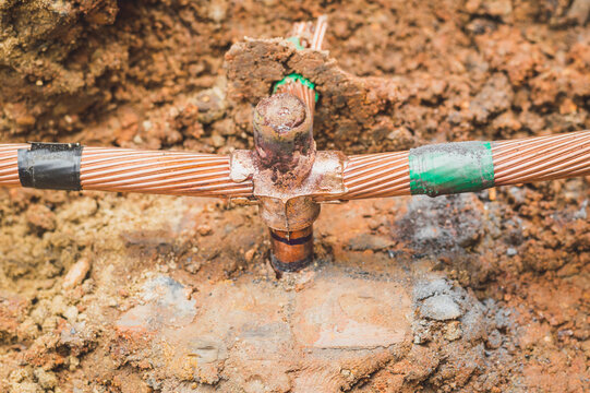 Welding copper ground wire on ground rod.Welding copper ground wire.Connect copper grounding lightning protection system. With the melting