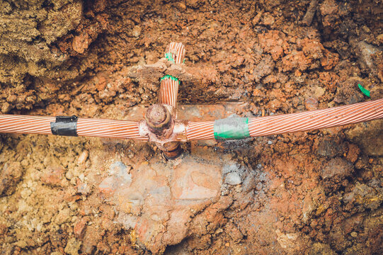 Welding copper ground wire on ground rod.Welding copper ground wire.Connect copper grounding lightning protection system. With the melting