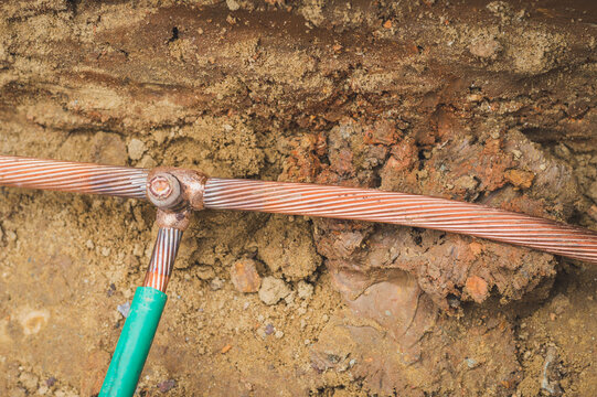 Welding copper ground wire on ground rod.Welding copper ground wire.Connect copper grounding lightning protection system. With the melting